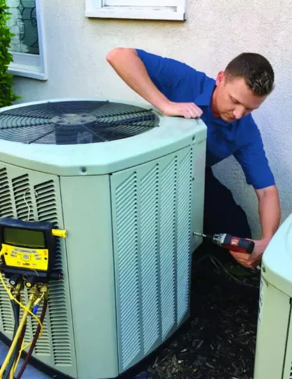 Technician inspecting a clogged air filter in an air conditioning unit, highlighting common issues